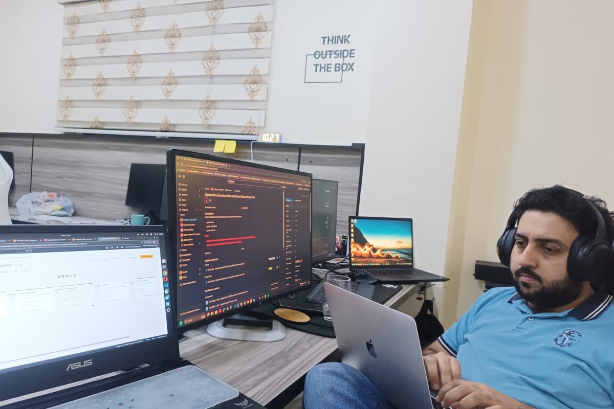 Engineers pair programming at workstation